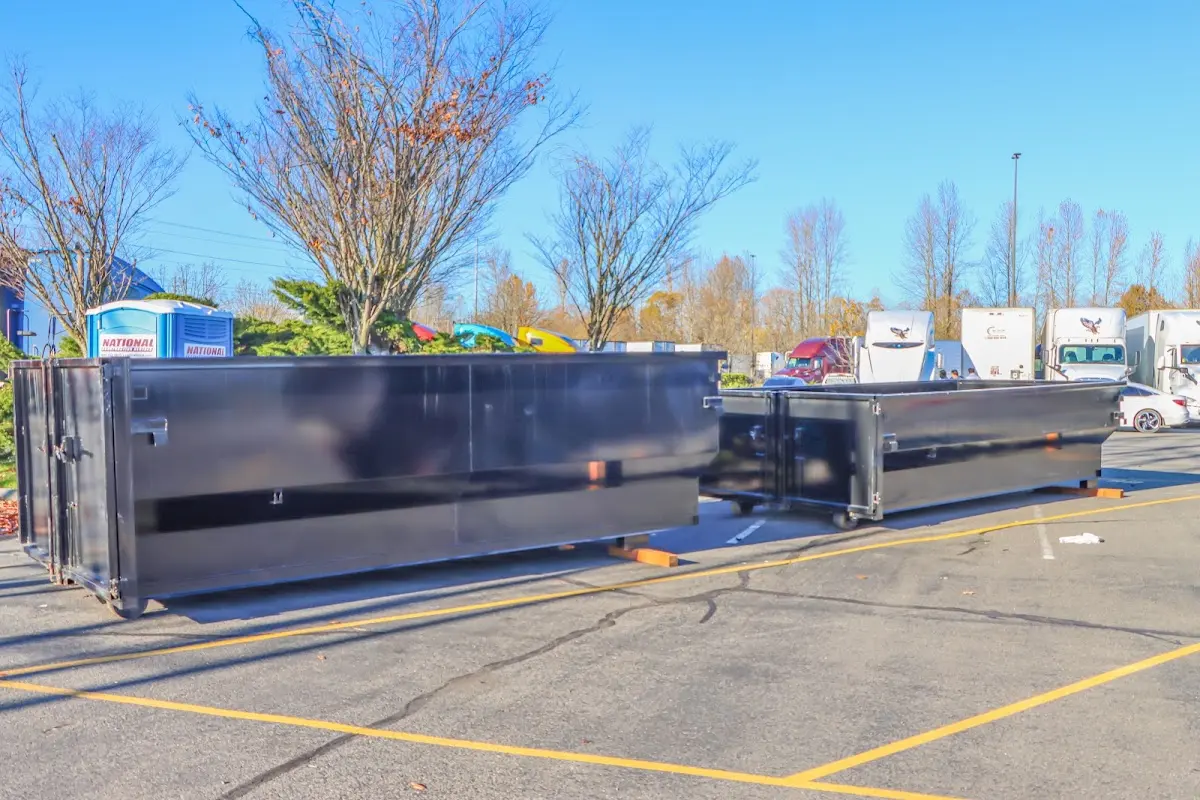 Professional dumpster rental service with roll-off container on residential driveway in Sulphur Springs