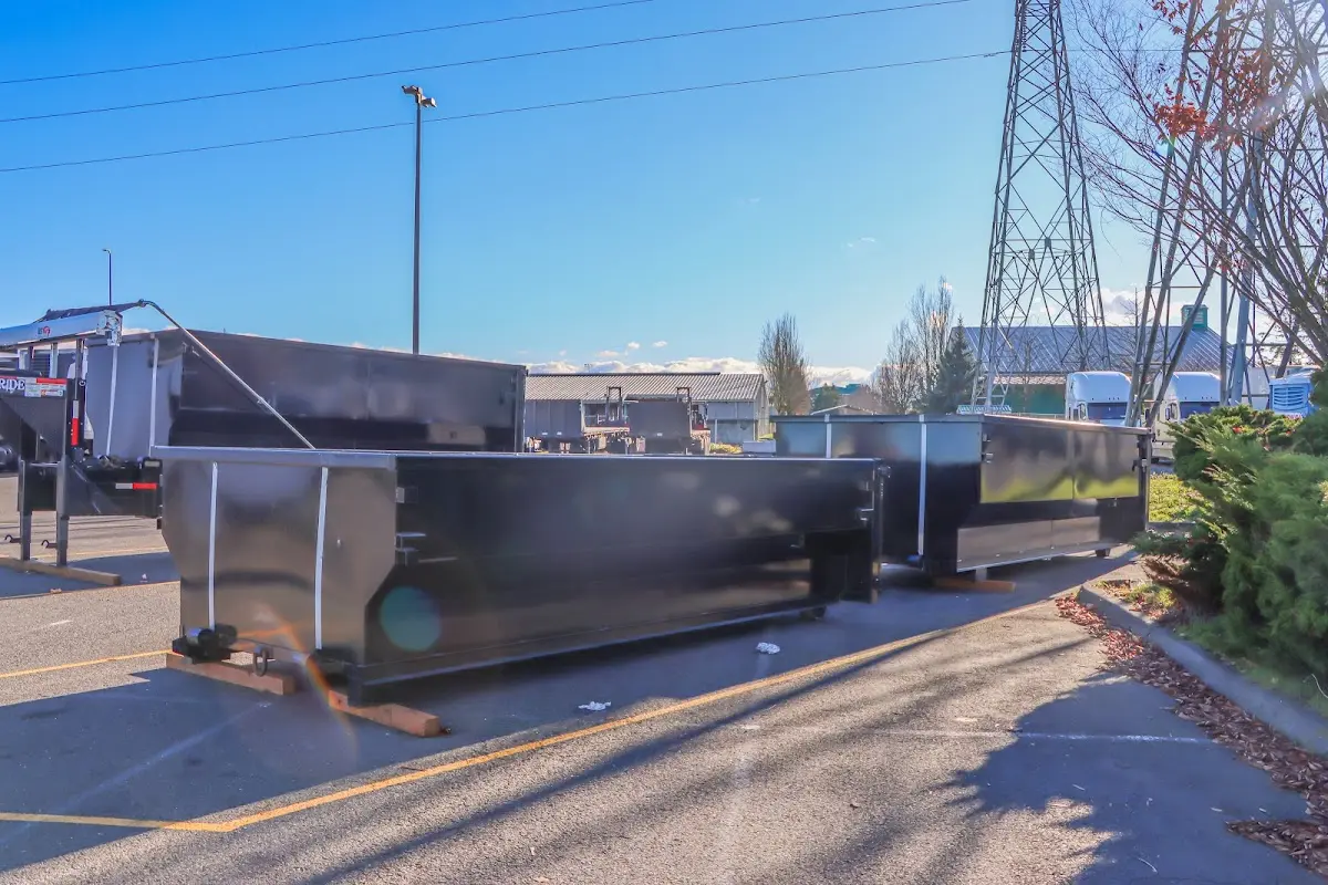 Roll-off dumpster ready for waste disposal at job site for 2 Yard Dumpster Rental in Sulphur Springs